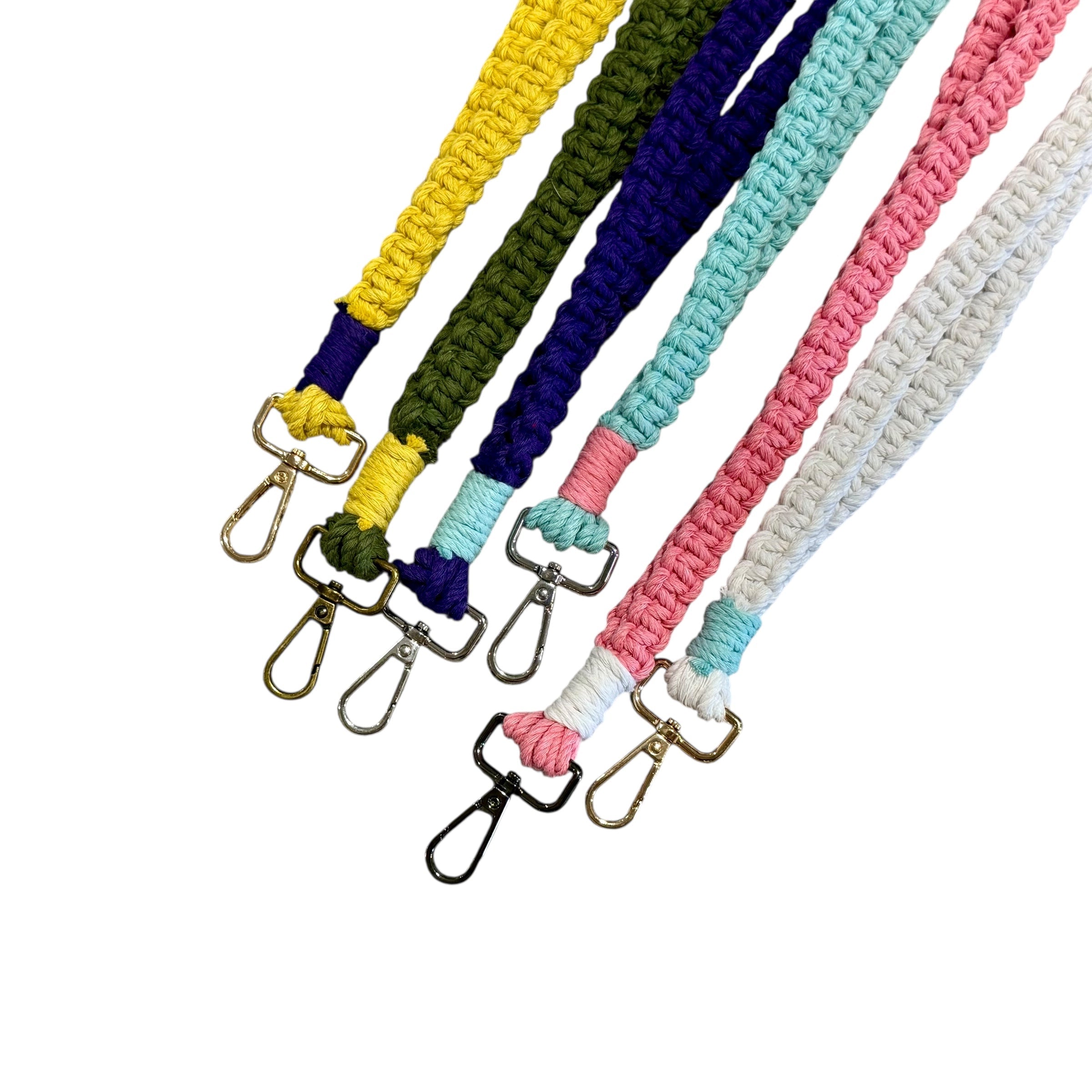 Set of colorful braided lanyards with metal hooks on a white background